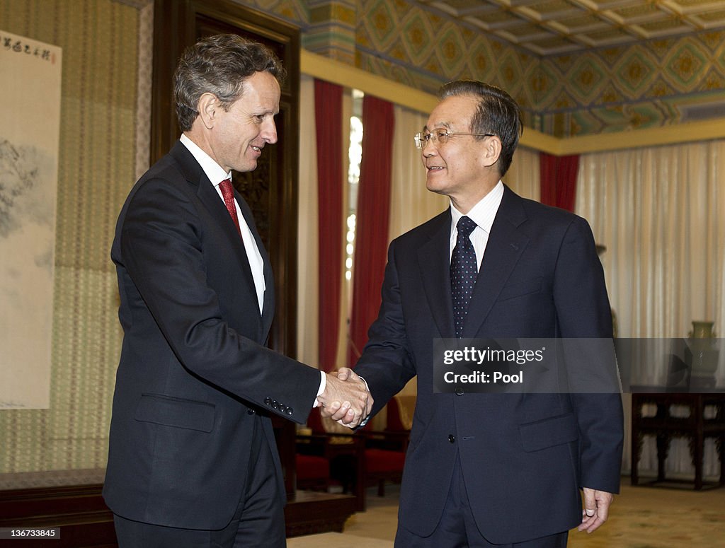Tim Geithner US Treasury Secretary Timothy Geithner shakes hands with Chinese ...