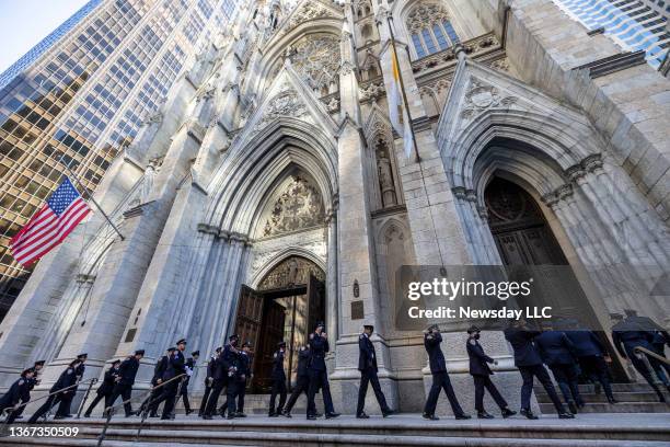 Line of police officers arrive at St. Patrick's Cathedral in Manhattan for wake services NYPD officer Jason Rivera on January 27, 2022. Rivera was...