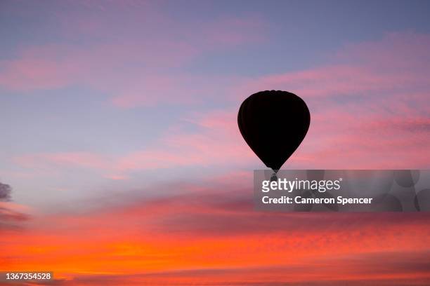 View of a hot air balloon above Melbourne at sunrise on January 24, 2022 in Melbourne, Australia.