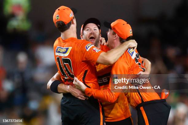 Mitch Marsh, Andrew Tye and Ashton Turner of the Scorchers celebrate winning BBL11 and the Men's Big Bash League match between the Perth Scorchers...