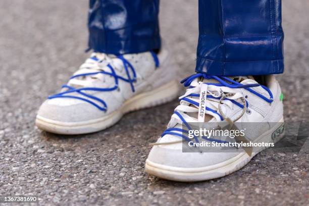 Influencer Nadine Tosun wearinga white dunk low lot32 by Nike x Off-White during a street style shooting on January 27, 2022 in Munich, Germany.