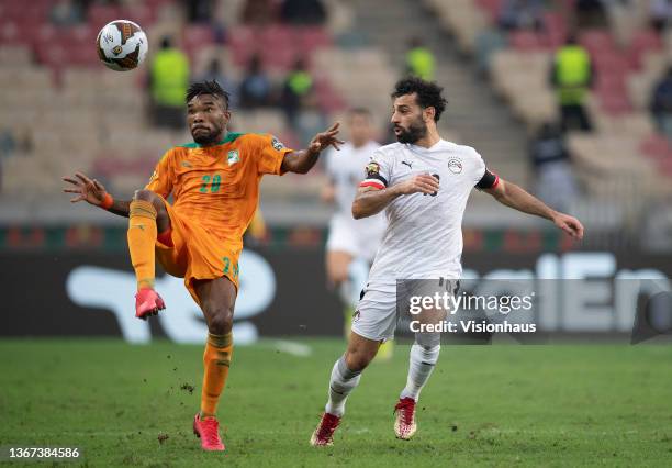 Of Ivory Coast and MOHAMED SALAH of Egypt during the Africa Cup of Nations 2021 round of 16 football match between Ivory Coast and Egypt at Stade de...