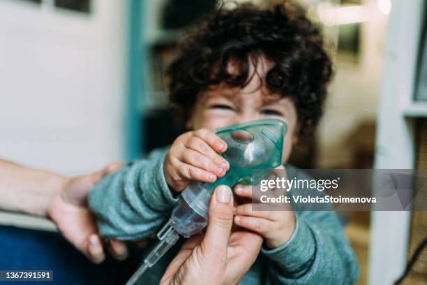 little boy makes inhalation at home. - inhalation stock pictures, royalty-free photos & images