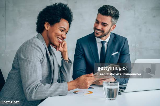 business people having a meeting in the office. - african ethnicity laptop stock pictures, royalty-free photos & images