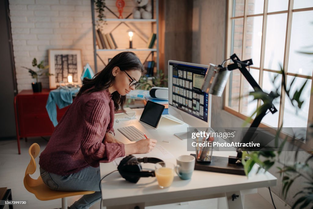 Photographer Editing Photos on her computer.