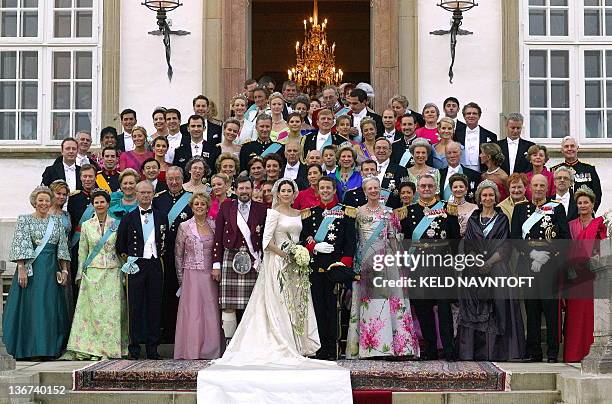 Crown Prince Frederik and Crown Princess Mary pose with family and guests on the stairs to Fredensborg Palace prior to the wedding banquet Friday May...