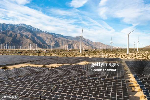 aerial view over solar panels and windmills - palm desert california stock pictures, royalty-free photos & images