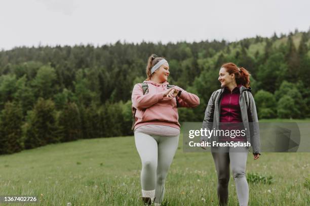 two female friends having an activity holiday in the countryside - overweight stock pictures, royalty-free photos & images