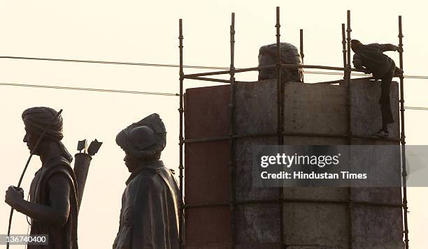 Workers covering the grand statue of Bahujan Samaj Party Chief Mayawati at Dalit Prerna Sthal on January 10, 2012 in Noida, India. India's Election...
