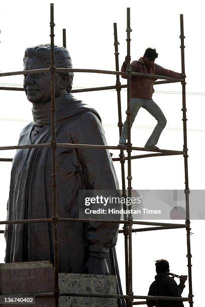 Workers covering the grand statue of Bahujan Samaj Party Chief Mayawati at Dalit Prerna Sthal on January 10, 2012 in Noida, India. India's Election...