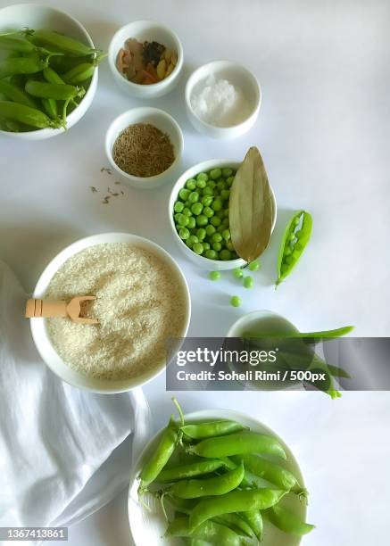 matar pulao preparation,high angle view of various ingredients on table,chattogram,bangladesh - matar stock pictures, royalty-free photos & images
