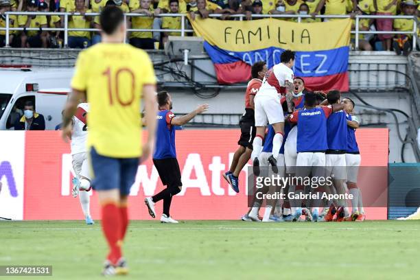 Edison Flores of Peru celebrates with teammates after scoring the first goal of his team during a match between Colombia and Peru as part of FIFA...