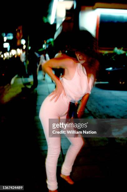 An unidentified woman poses while walking the Sunset Strip circa August, 1987 in Los Angeles, California.