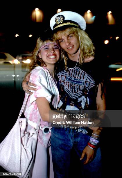 An unidentified couple pose for a portrait on the Sunset Strip circa August, 1987 in Los Angeles, California.