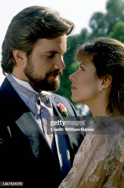 American actor Lane Davies and American actress Nancy Lee Grahn , during the wedding of Kelly Capwell, played by Robin Wright , of the American...