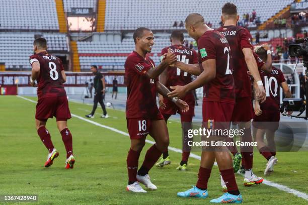 Salomón Rondón of Venezuela celebrates with teammates after scoring his team's second goal during a match between Venezuela and Bolivia as part of...