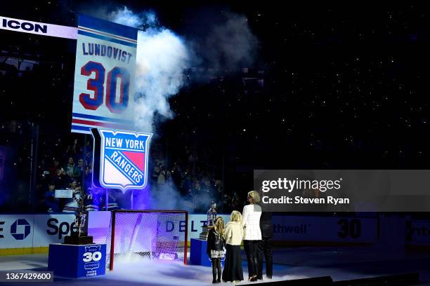 Former New York Ranger Henrik Lundqvist and his family watch the banner being raised to the rafters during Lundqvist's jersey retirement ceremony...