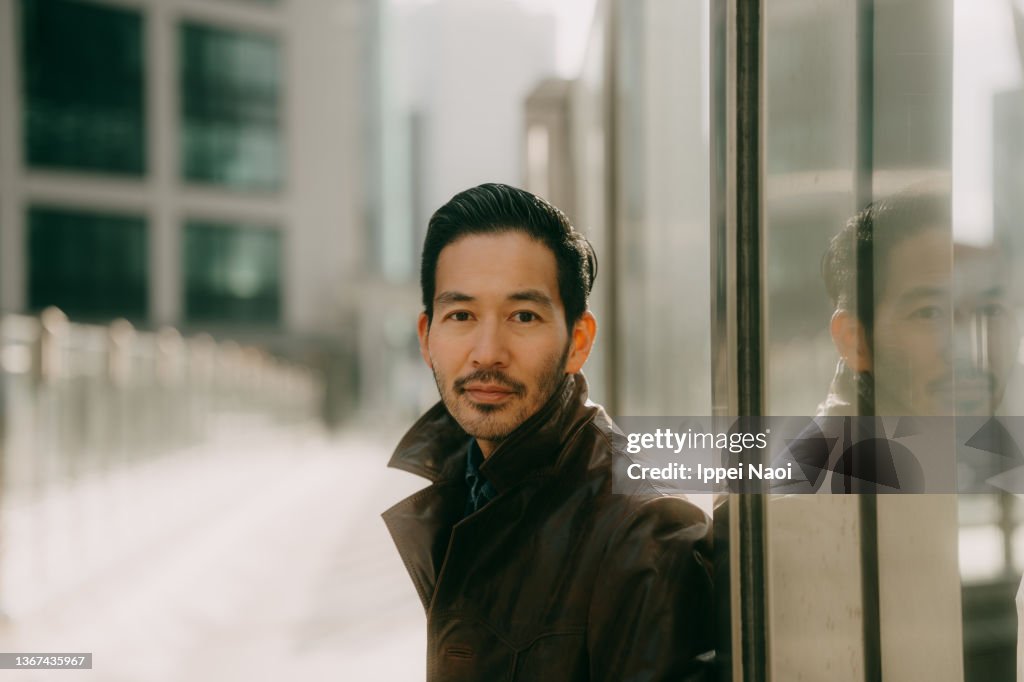 Portrait of man in city, Tokyo, Japan