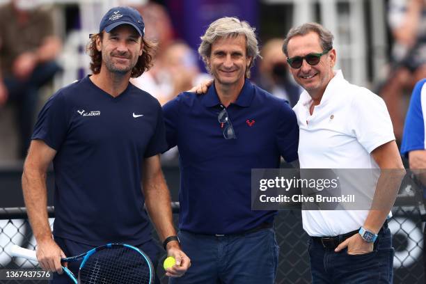 Carlos Moya, Rafael Nadal's coach, Carlos Costa and Benito Perez Barbadillo pose during day 13 of the 2022 Australian Open at Melbourne Park on...