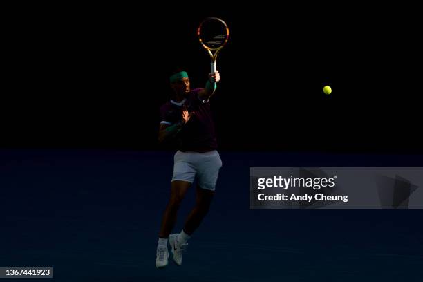 Rafael Nadal of Spain plays a forehand in his Men's Singles Quarterfinals match against Denis Shapovalov of Canada during day nine of the 2022...