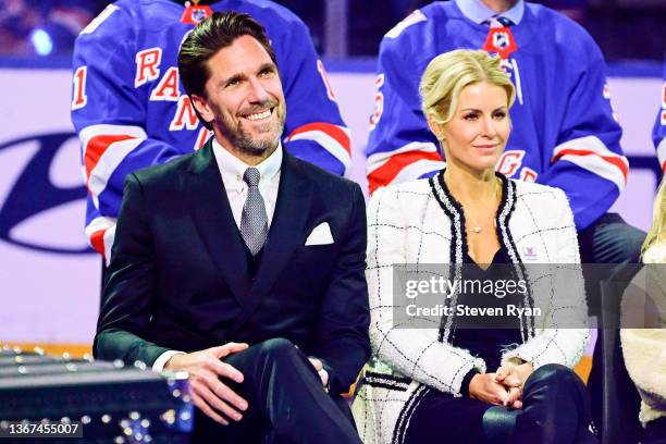 Former New York Ranger Henrik Lundqvist and wife Therese Lundqvist take part in the jersey retirement ceremony prior to a game between the New York...