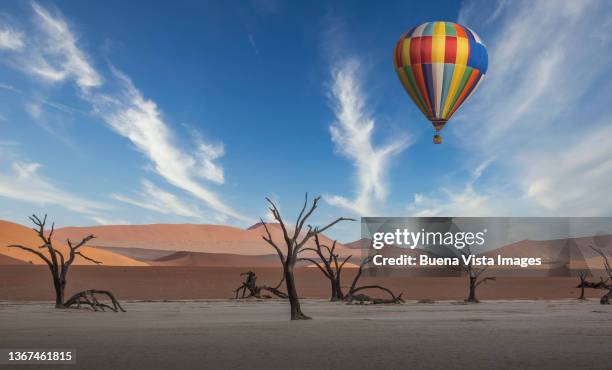 namibia. hot air balloon flying over desert. - sossusvlei stock pictures, royalty-free photos & images