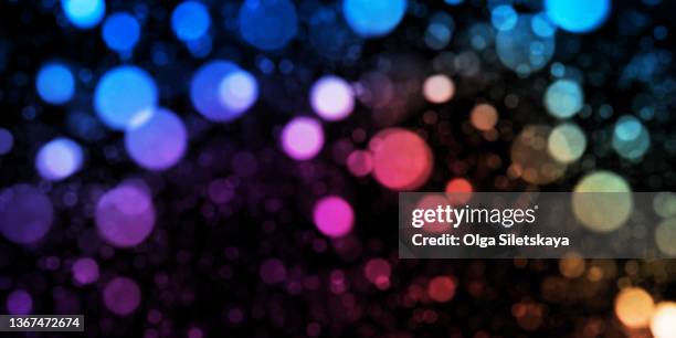 abstract defocused lights background - rainbow lens flare stock pictures, royalty-free photos & images