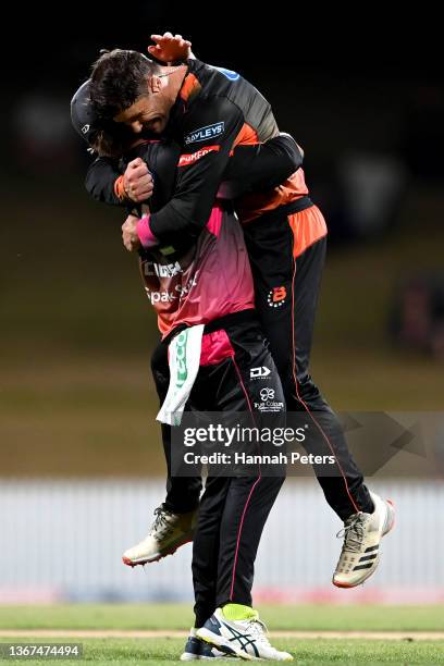 Joe Walker of the Northern Brave celebrates the wicket of Mitch Hay of the Canterbury Kings with Henry Cooper of the Northern Brave during the Super...