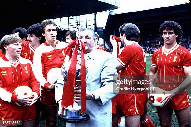 Liverpool manager Bob Paisley poses with the winning First Division League Championship trophy in his last season in charge of the club with his...