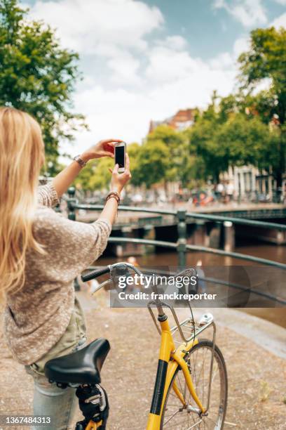 beautiful woman take a selfie in amsterdam - tulips amsterdam stock pictures, royalty-free photos & images