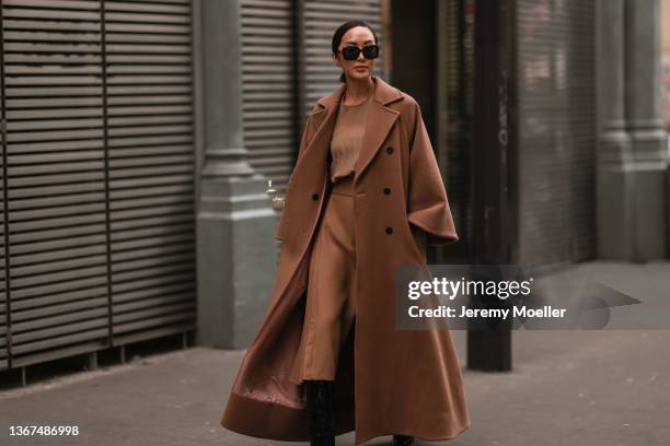 Chriselle Lim is seen outside Elie Saab during Paris Fashion Week Haute Couture Spring/Summer 2022 on January 26, 2022 in Paris, France.