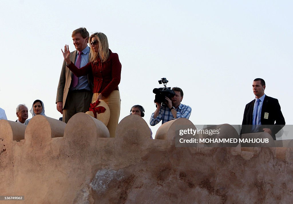 Prince Willem-Alexander looks on as and