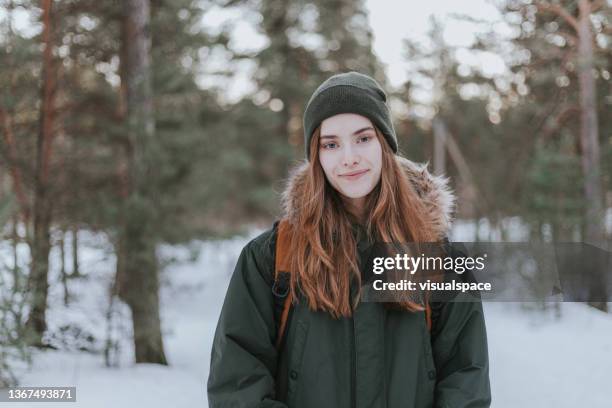 portrait of young woman on a winter hike - scandinavian descent stock pictures, royalty-free photos & images