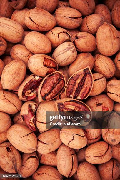 close up of pecan nuts background - bolster stockfoto's en -beelden