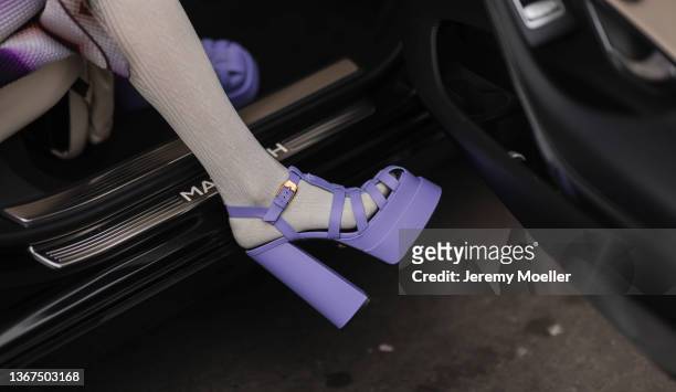 Guest is wearing purple high heels and a purple handbag outside Fendi, during Paris Fashion Week - Haute Couture Spring/Summer 2022 on January 27,...