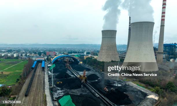 Aerial view of the coal yard and cooling towers at the Jiangyou Power Station on January 28, 2022 in Jiangyou, Mianyang City, Sichuan Province of...