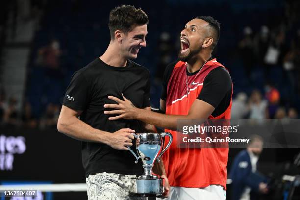 Thanasi Kokkinakis of Australia and Nick Kyrgios of Australia pose with the championship trophy after winning their Men's Doubles Final match against...
