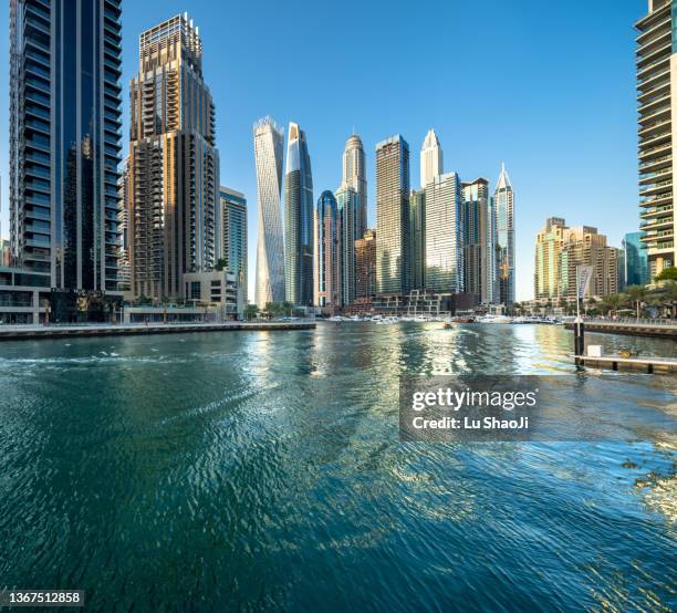 urban skyline and modern skyscrapers in dubai marina. - dubai water canal stock pictures, royalty-free photos & images