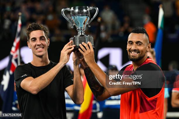 Nick Kyrgios of Australia and Thanasi Kokkinakis of Australia celebrate with the winner's trophy after beating Max Purcell of Australia and Mathew...