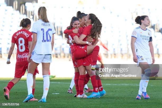Natalia Gaitan of Sevilla FC celebrates with team mates after scoring their team's first goal during the Primera Iberdrola match between Real Madrid...