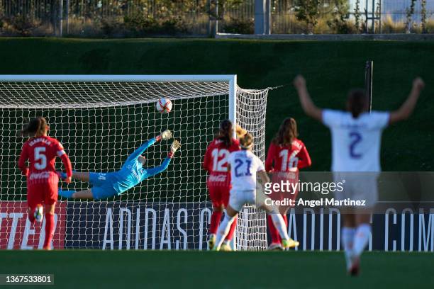 Claudia Zornoza of Real Madrid scores her team's second goal past Esther Sullastres of Sevilla FC during the Primera Iberdrola match between Real...