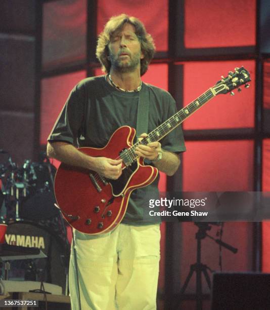 British Rock and Blues musician Eric Clapton plays guitar as he performs onstage at Madison Square Garden, New York, New York, October 8, 1994.