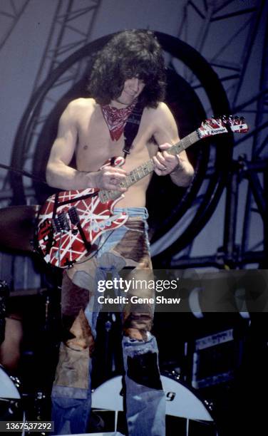 Dutch-born American rock musician Eddie Van Halen plays guitar as he performs onstage, with the group Van Halen, at Madison Square Garden, New York,...