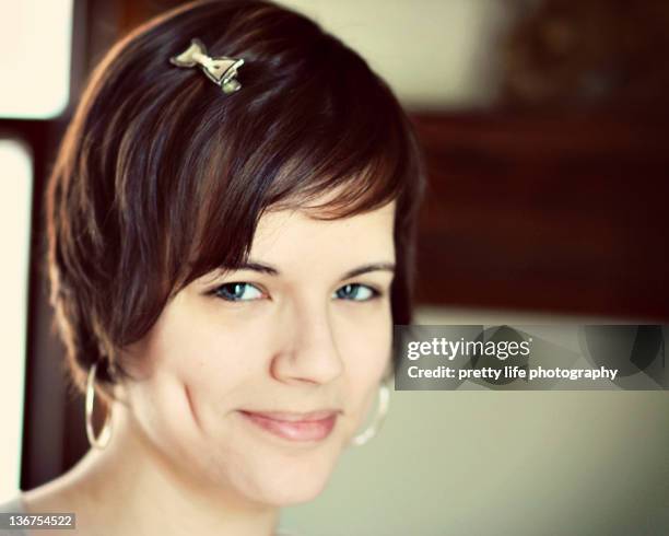 close up of young girl - brown hair blue eyes and dimples stockfoto's en -beelden