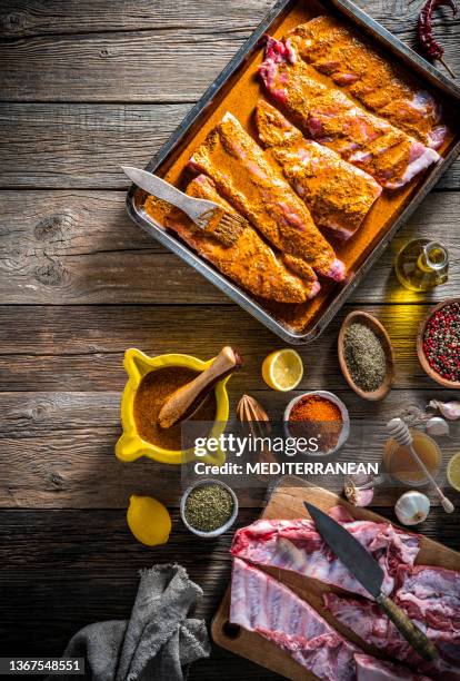 barbecue pork ribs raw marinated homemade with ingredients, herbs and spices - barbecue pork stock pictures, royalty-free photos & images