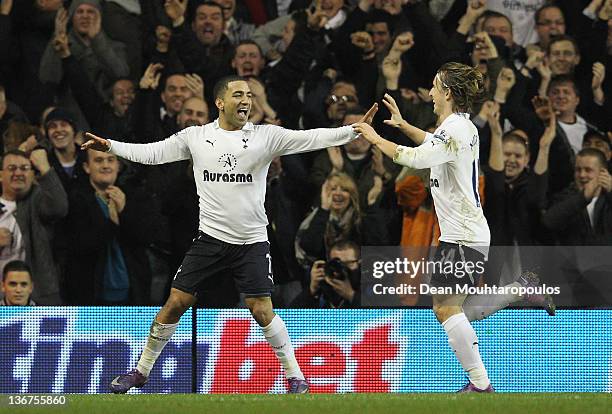 Aaron Lennon of Spurs celebrates scoring the opening goal with team mate Luka Modric of Spurs during the Barclays Premier League match between...