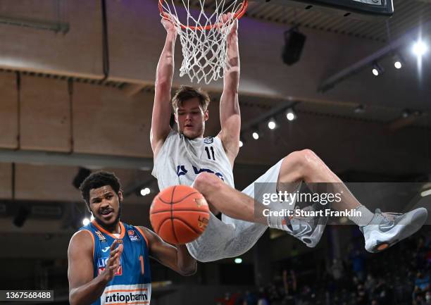 Cristiano Felicio of Ulm challenges Maik Kotsar of Hamburg during the BBL game between Hamburg Towers and Ratiopharm Ulm at edel-optics.de Arena on...