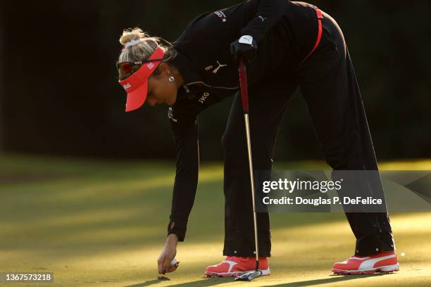 Lexi Thompson fixes the green on the 2nd green during the third round of the 2022 Gainbridge LPGA at Boca Rio Golf Club on January 29, 2022 in Boca...