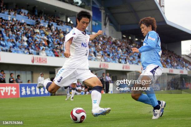 Oh Beom-Seok of Yokohama FC and Kota Ueda of Jubilo Iwata compete for the ball during the J.League J1 match between Jubilo Iwata and Yokohama FC at...