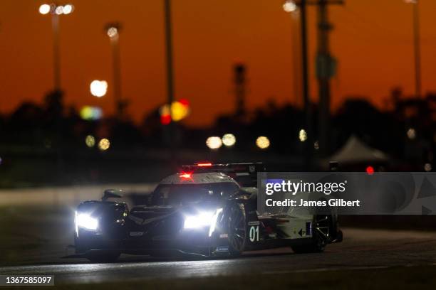 The Cadillac Chip Ganassi Racing Cadillac DPi of Renger Van Der Zande, Scott Dixon, Sebastien Bourdais, and Alex Palou drives during sunset at the...